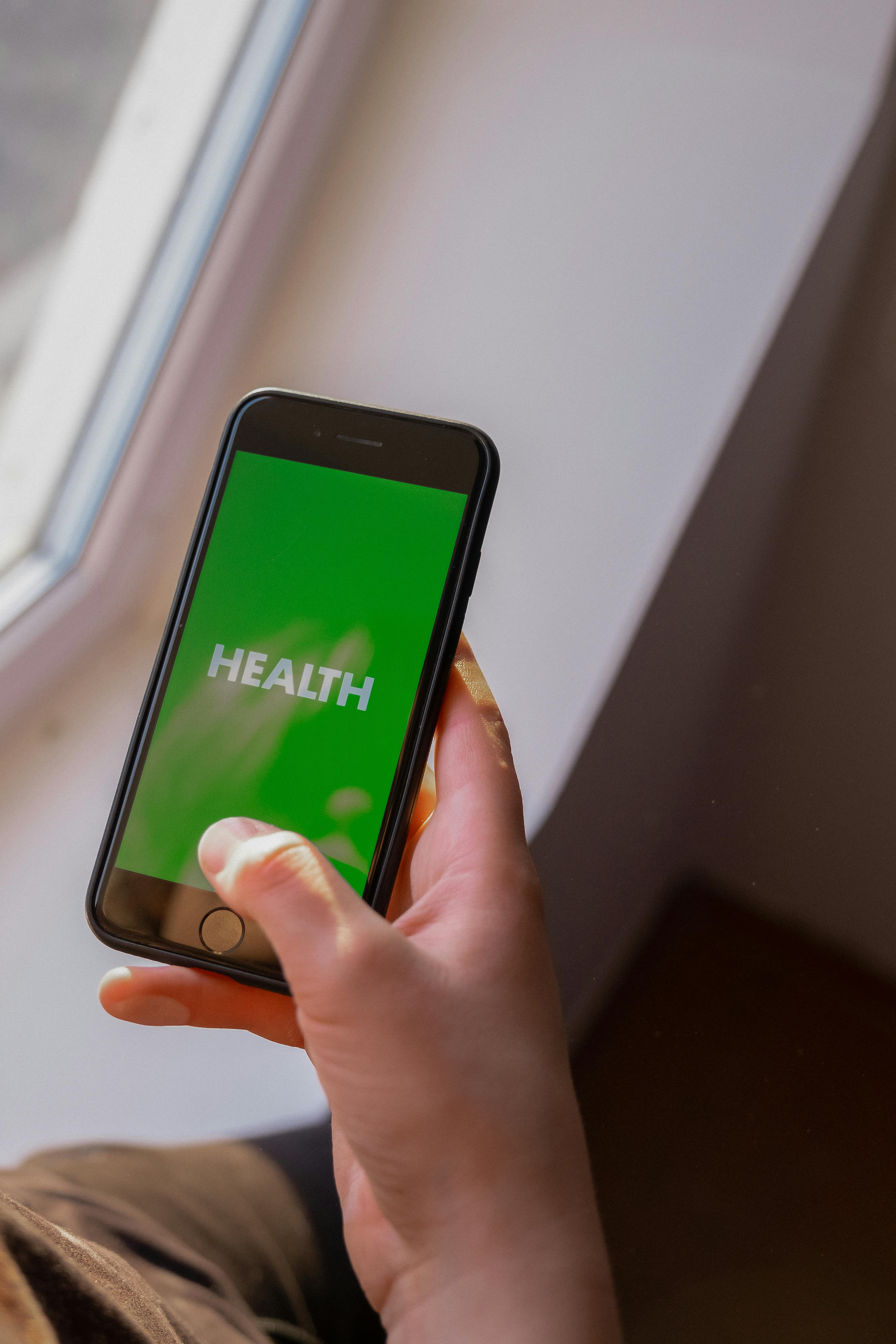 Person using mental health app on phone, representing accessible digital neurodivergent support